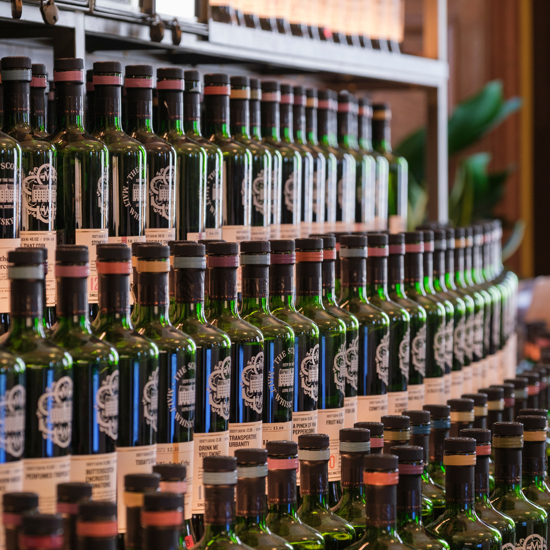 Lots of SMWS single cask whisky bottles on the back bar 